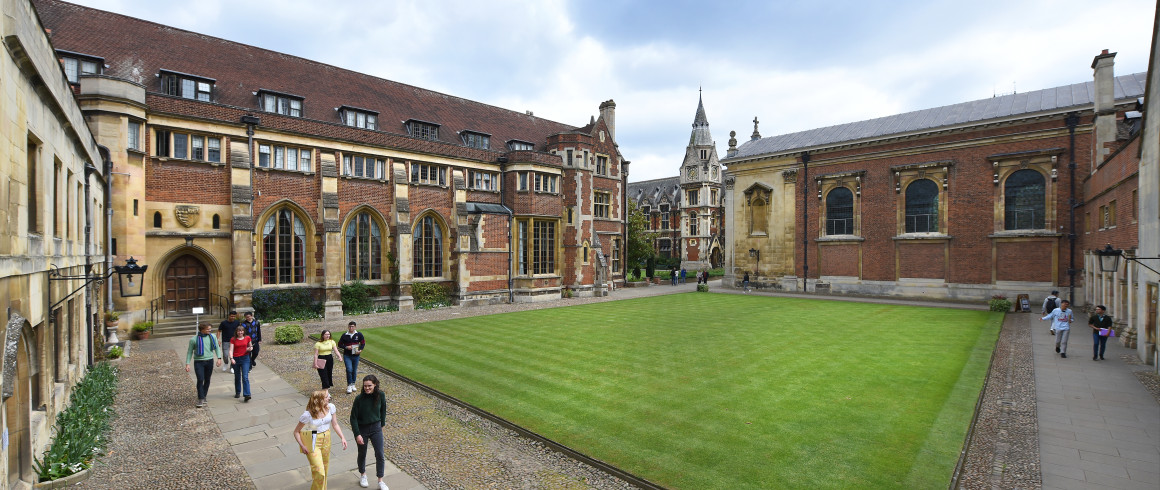 Old Court wide view with students walking along the paths