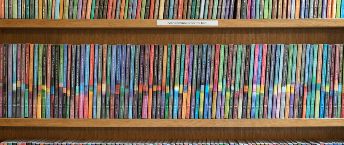 Image of colourful books on bookshelf