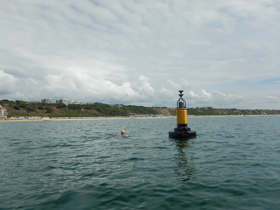 Dan Shailer swims past a buoy (copyright Dan Shailer)