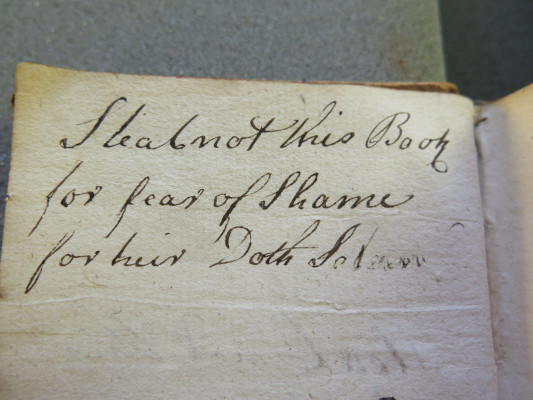 Curse inscription from the flyleaf of a 1727 French New Testament 