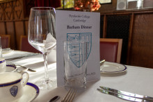 Table laid for Barham Dinner with Menu card proepped between glasses