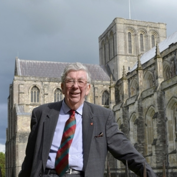 Professor Martin Biddle with buildings behind
