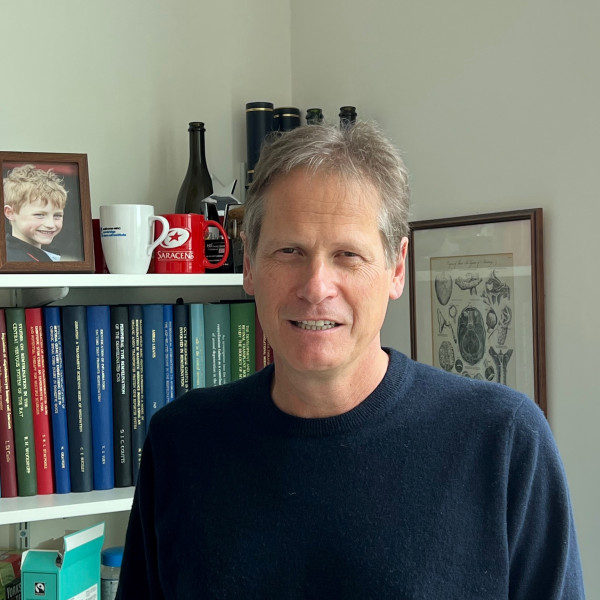 Professor Robin Franklin with books behind